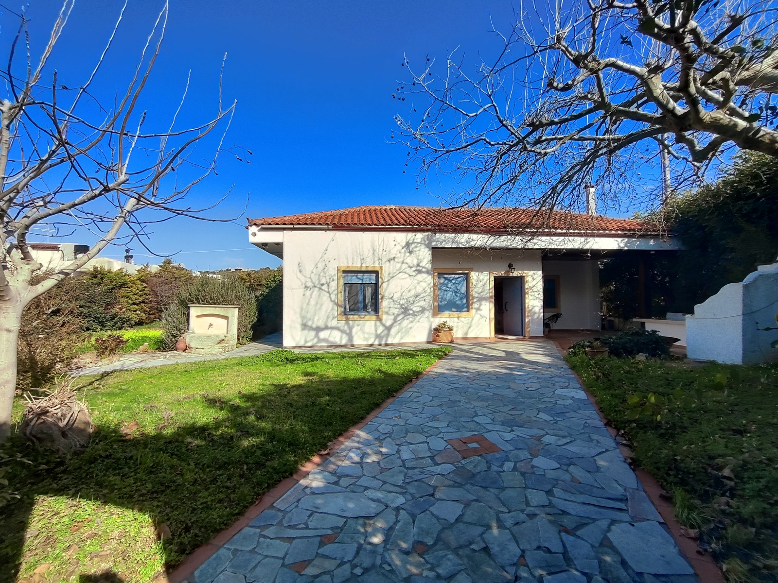 Traditional stone house luxuriously furnished with wooden ceilings and tiled roof.