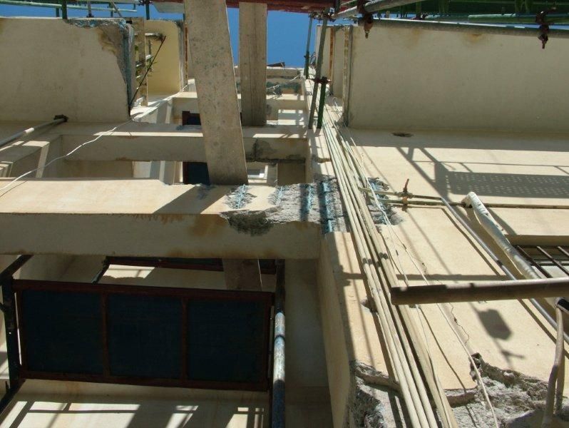 Επισκευές οπλισμού, μονώσεις τοίχων, χρωματισμός.