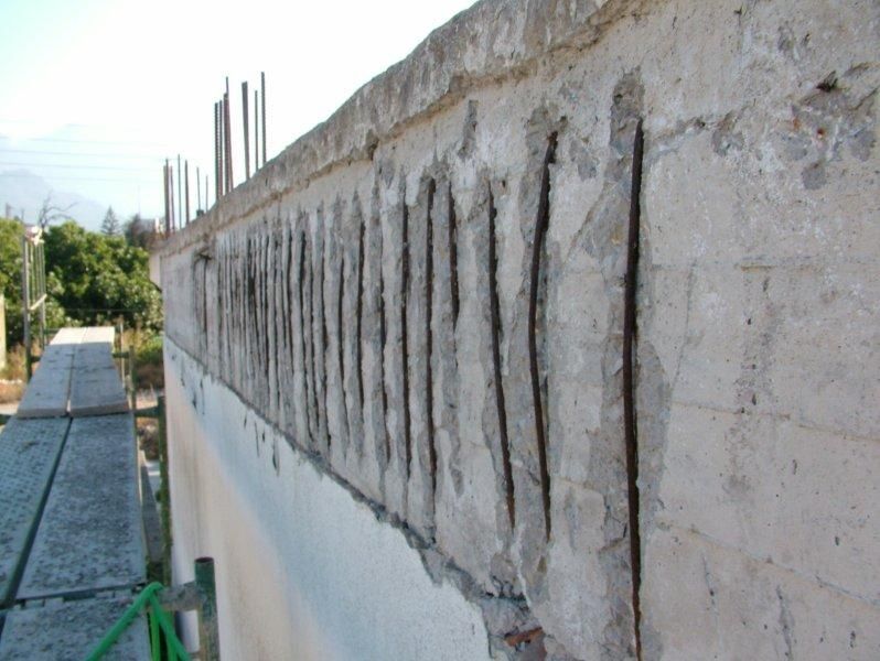 Επισκευές οπλισμού, μονώσεις τοίχων, χρωματισμός υγρομόνωση ταράτσας.